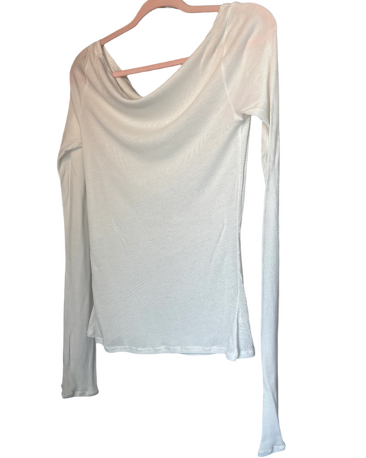 White long-sleeve top on a hanger against a plain background