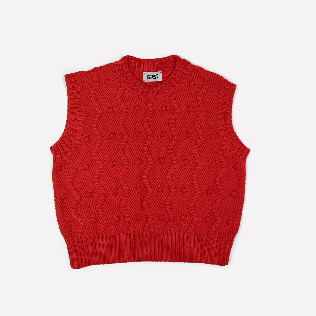 Red merino wool sweater vest with zig-zags and mini pom-poms