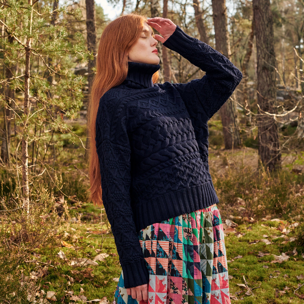 Navy merino wool cable knit turtleneck sweater