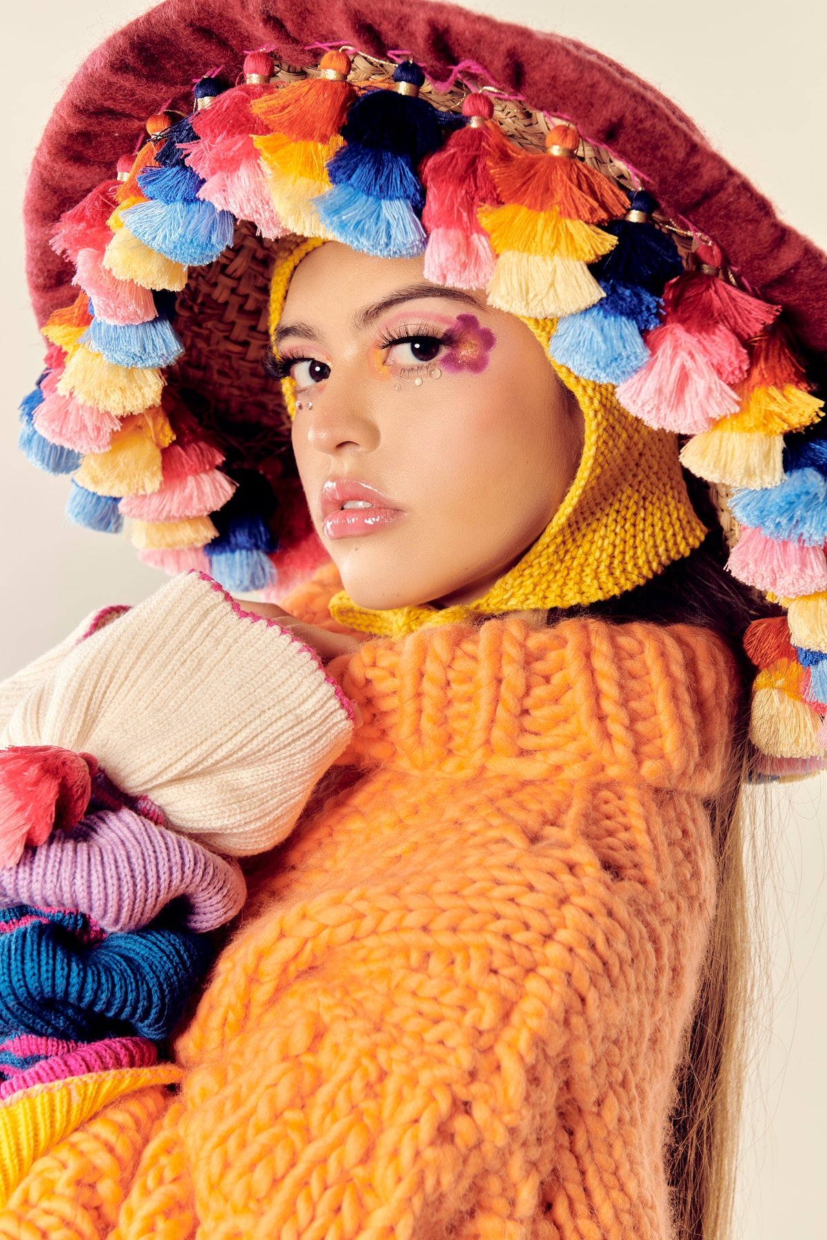 Líneas Poéticas hand-knit wool tassel hat by Matríaca Studio