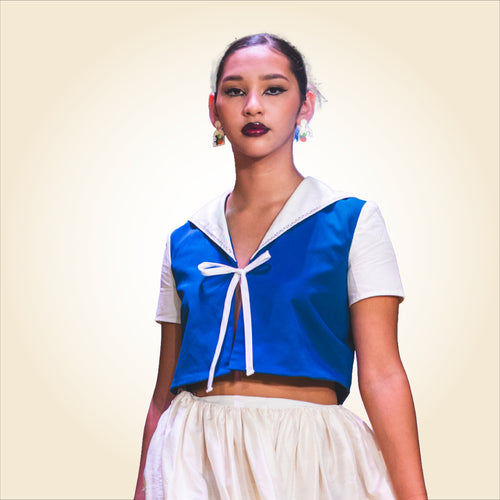 Cerulean blue woven cotton crop top with white sailor collar and green embroidery
