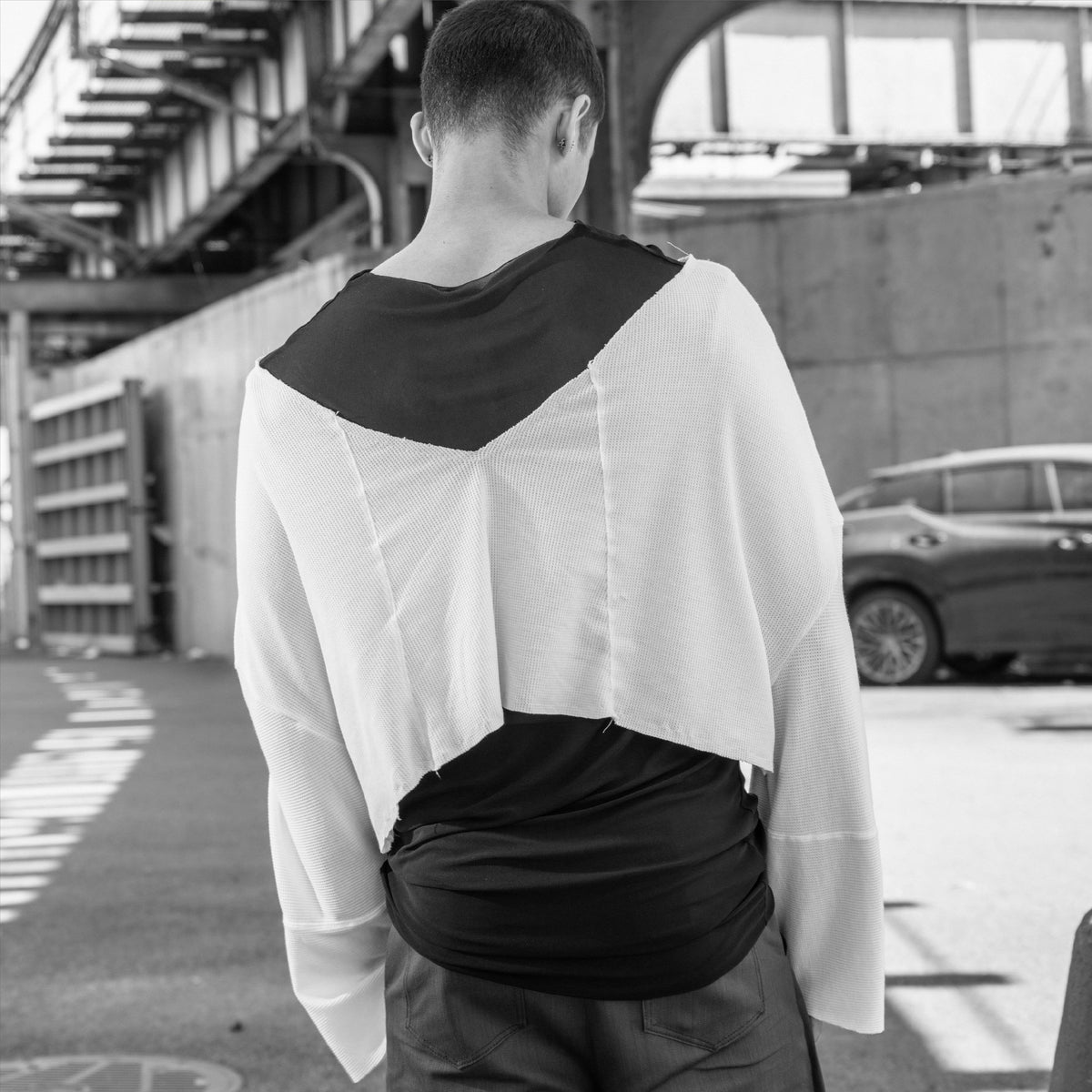 White long sleeve knit top with deep V neckline